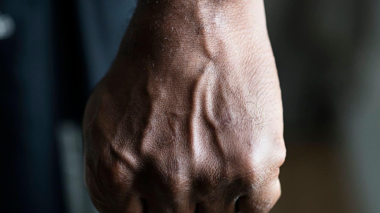 Man with clenched fist.